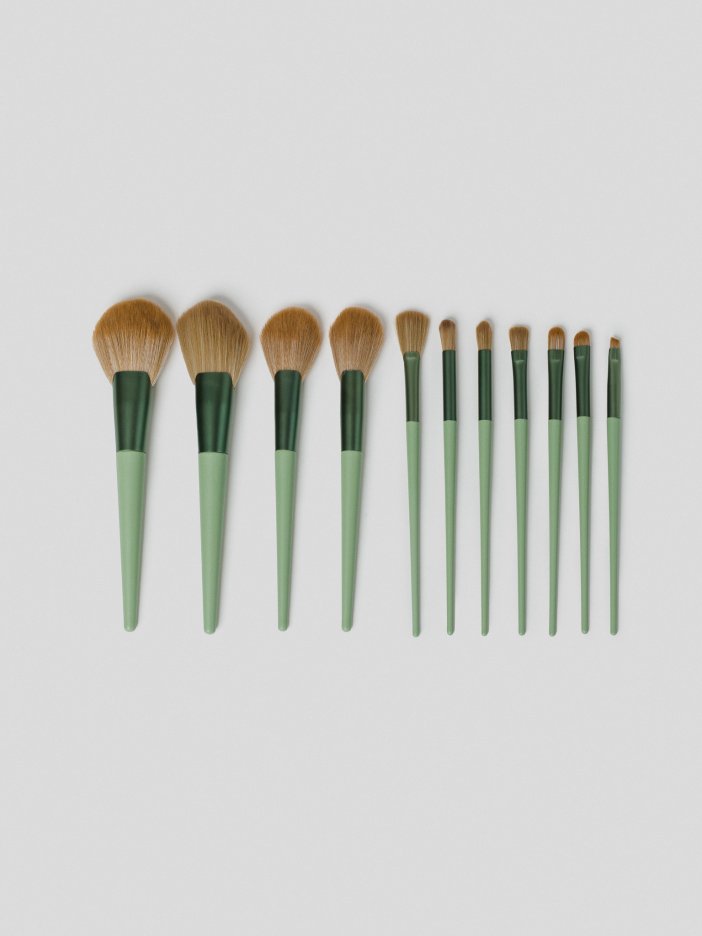 Green set of makeup brushes