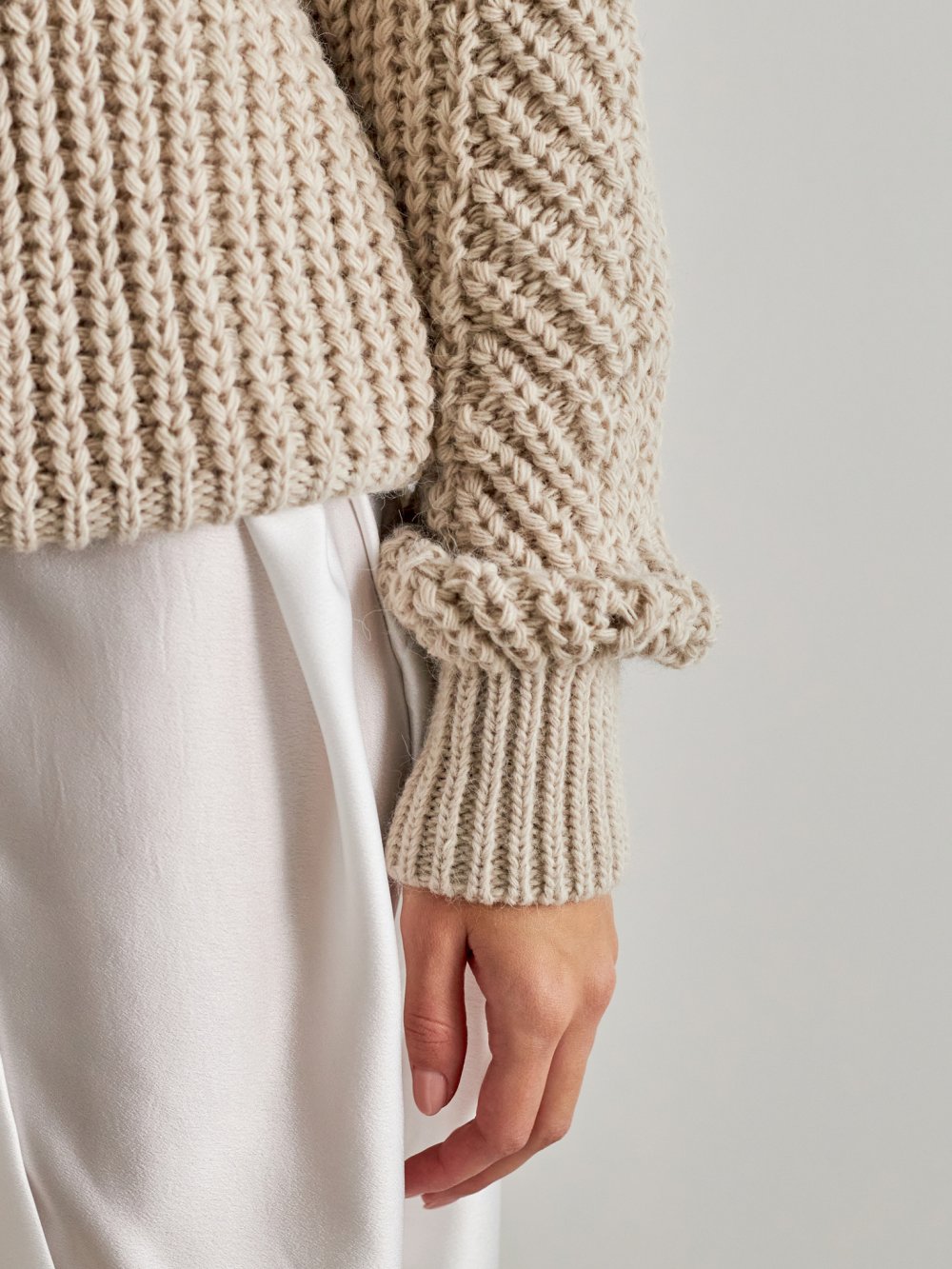Béžový pletený sveter Dior